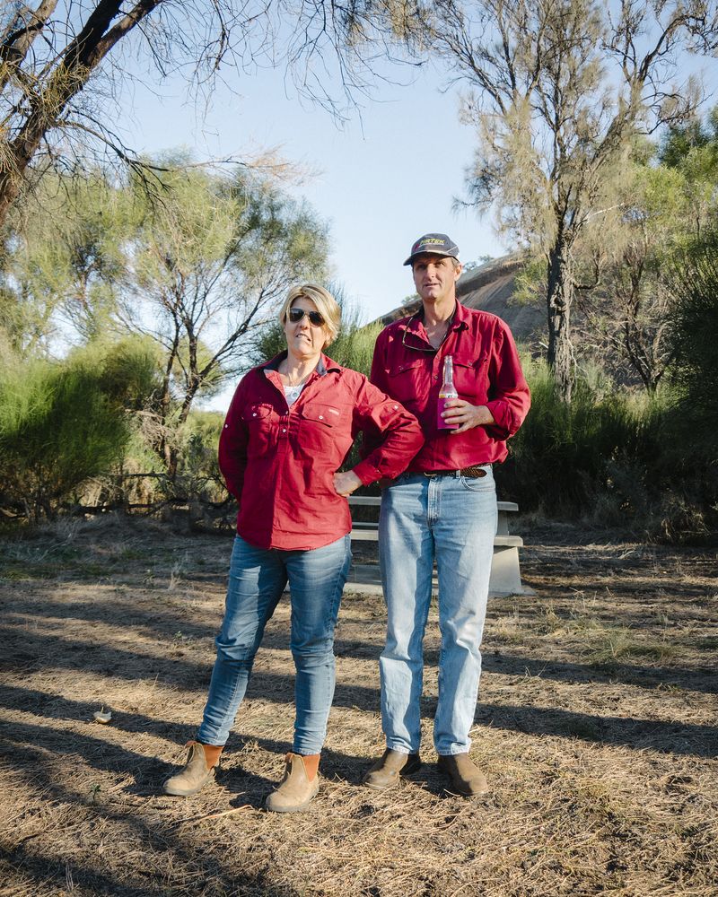 © Claudia Caporn - Jason and Lisa, both 49, a farming couple, enjoying a beer after a hard day of sheep work.