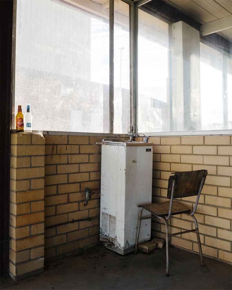 © Claudia Caporn - An old, unused water fountain at the town's Community Building.