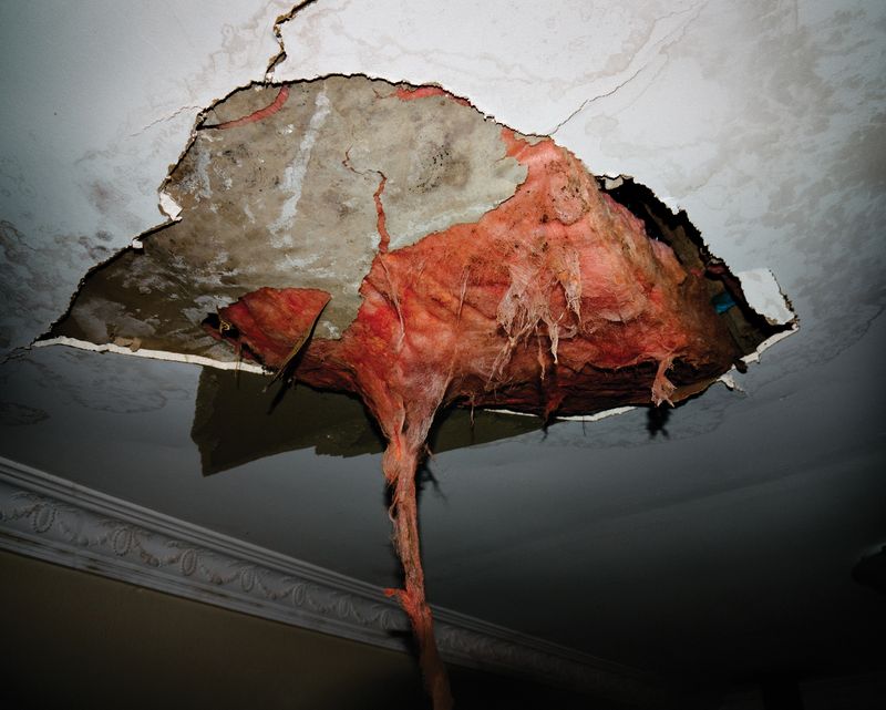 © Claudia Caporn - A collapsed ceiling in a local resident's living room after a severe storm.