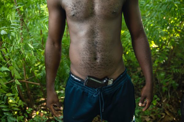 © RODRIGO ABD - A gang member in a field on the outskirts of Port-au-Prince, Wednesday, Oct. 6, 2021