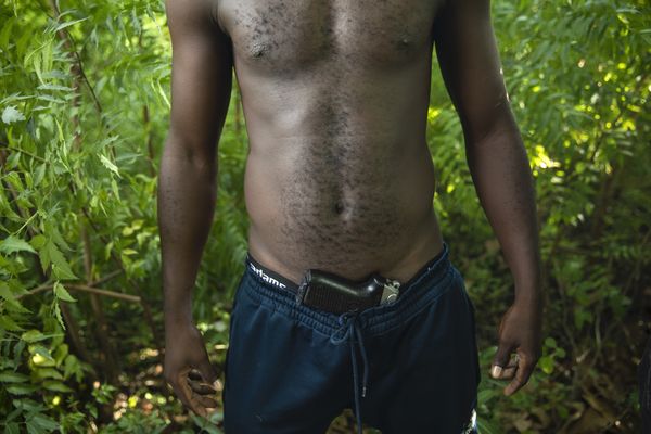 © RODRIGO ABD - A gang member in a field on the outskirts of Port-au-Prince, Wednesday, Oct. 6, 2021
