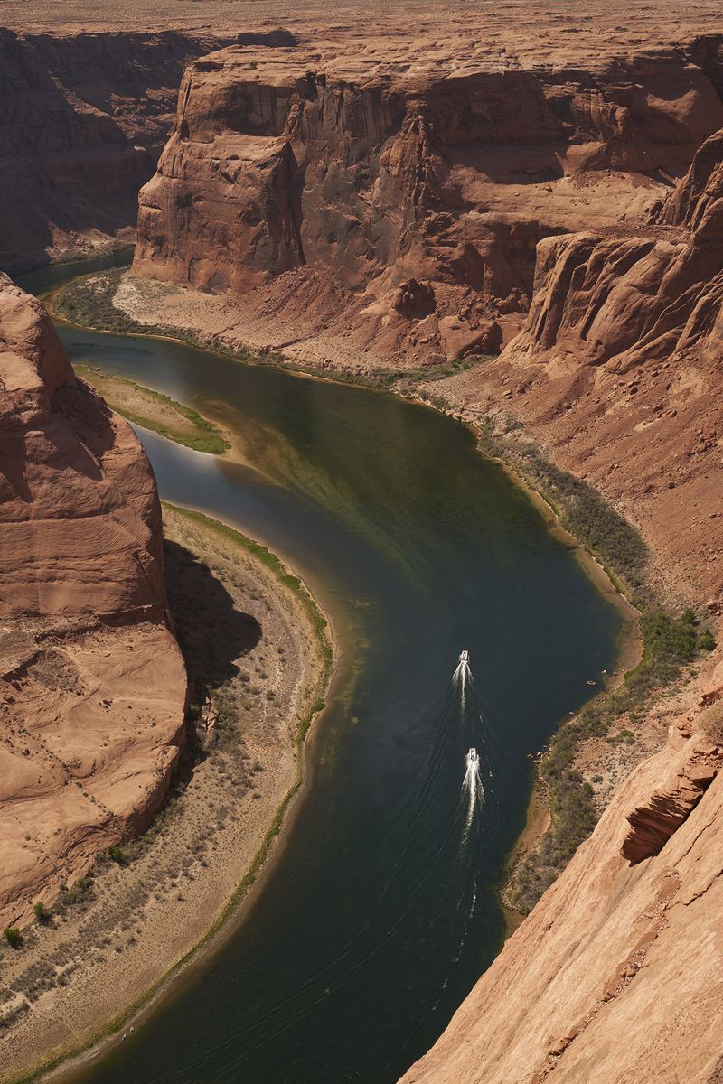 © Tanya Houghton - Boaters on the river at Horseshoe bend, Page, Arizona.