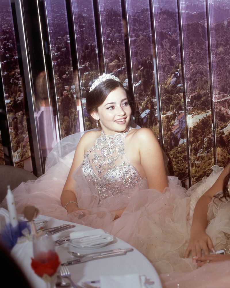 © Samantha Cabrera Friend - A quinceañera enjoys her time with fellow celebrants at the Great American Dining Hall on board.