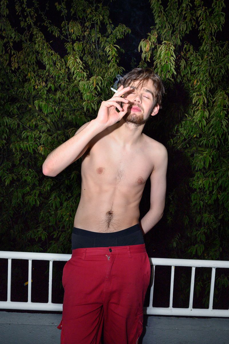 © Els Zweerink - Sammie smoking at the balcony after a night out.