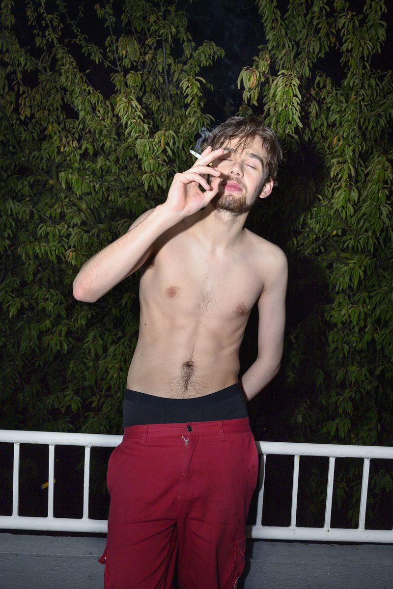 © Els Zweerink - Sammie smoking at the balcony after a night out.