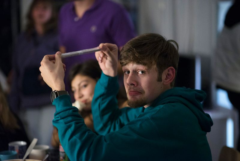 © Els Zweerink - Sammie on his 18th birthday. He shows his mother the joint he just prepared (it's a double joint: an elloe).