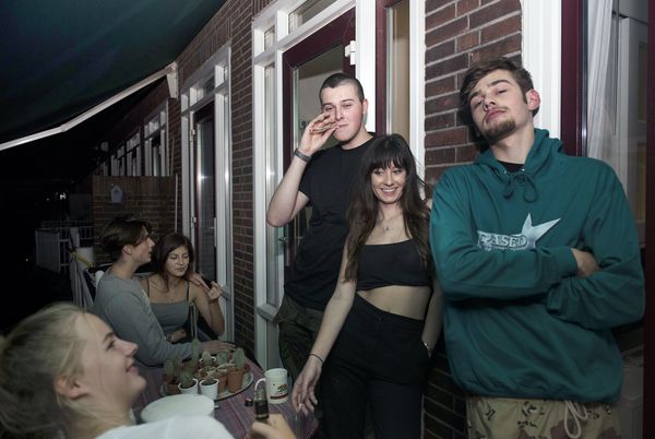 © Els Zweerink - Sammie on his 18th birthday. On the balcony they smoke the joint he just rolled (it's a double joint: an elloe).