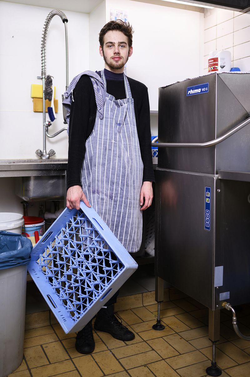 © Els Zweerink - First week in the restaurant where he works, doing the dishes.
