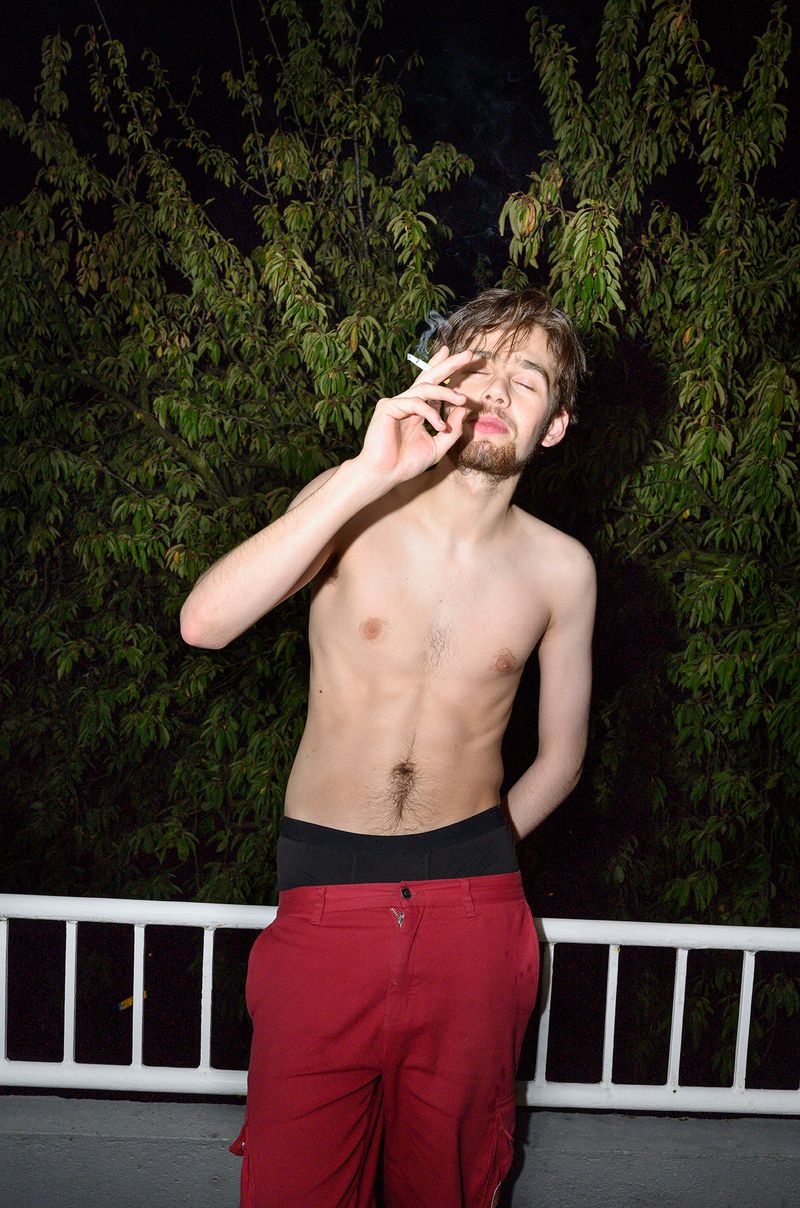 © Els Zweerink - Smoking at the balcony, and enjoying from a nice night out. He doesn't feel the cold.