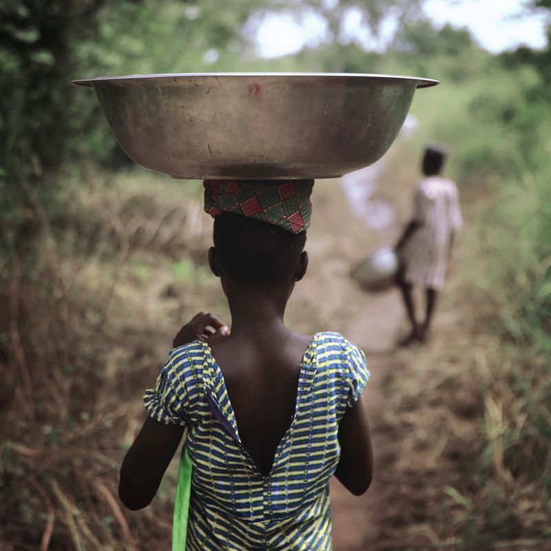 © Natalia Kovachevski - "Precious Quest" - A child who fetches water daily for his family, in a remote village in central Togo.