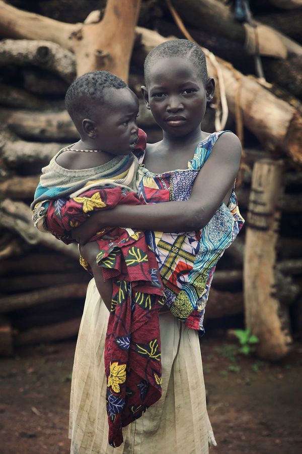 © Natalia Kovachevski - "The Sister" - Portrait of a little girl taking care of her little brother, in Sotouboua