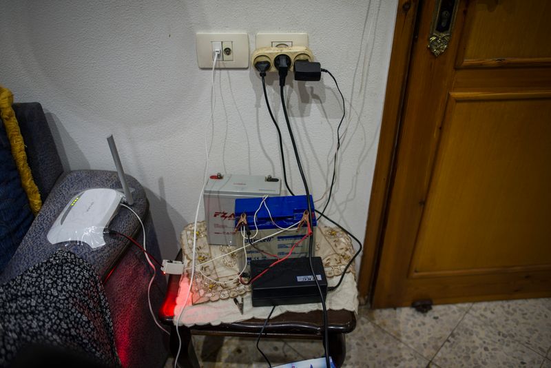 © Monique Jaques - A battery powers the modem at a home in Gaza to give the family internet access during the long blackouts.