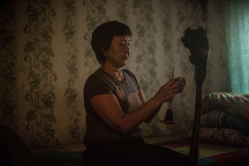 © Sally Low - Sasha's wife engages in traditional craft.