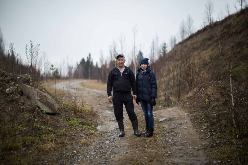 © Sally Low - Larisa and Sasha stand on the road where their Father fought against the previous mining company.