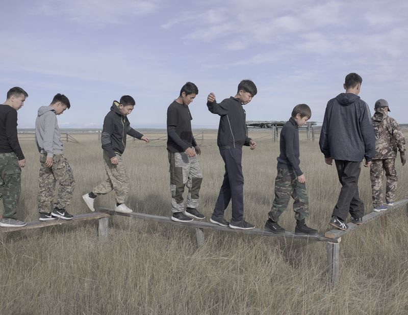 © Alexey Pavlov - Pupils pass an obstacle course during a military training camp