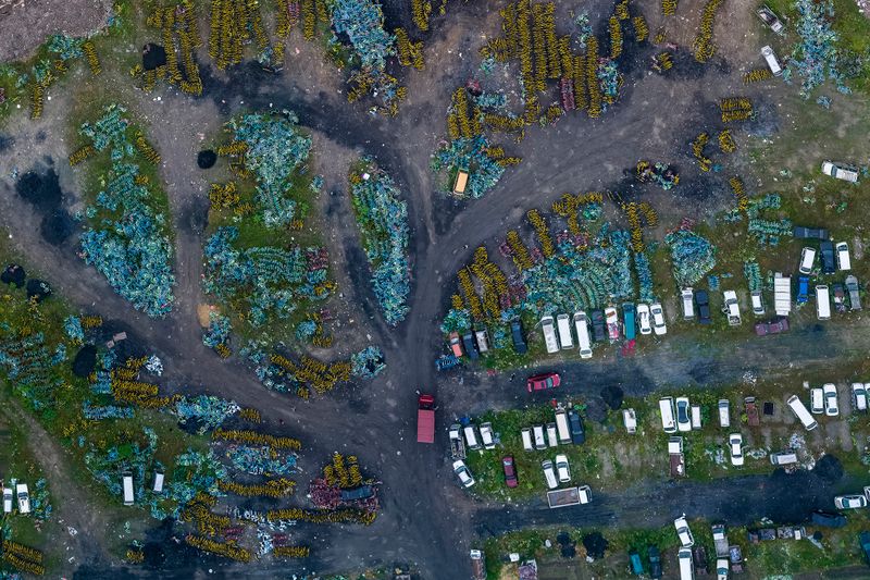 © WU GUOYONG - 09 Hangzhou,China In the shared bicycle cemetery, some scrap cars are mixed among them. 2018/05/19