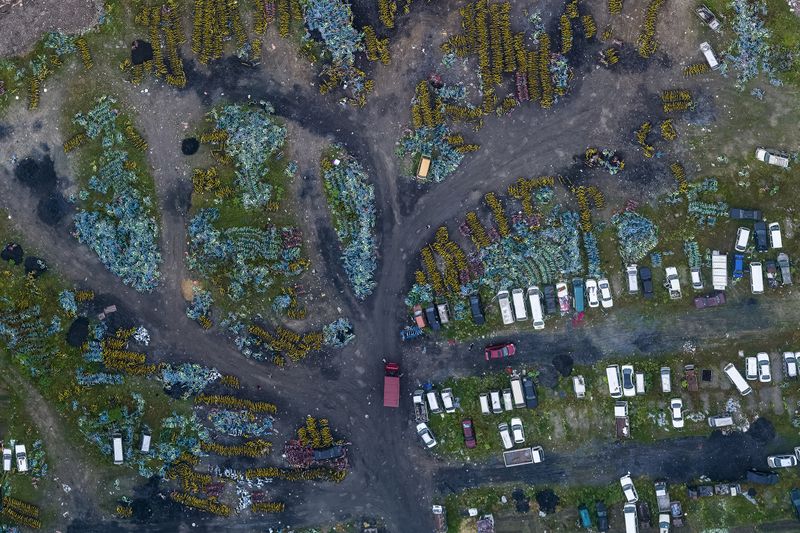 © WU GUOYONG - 09 Hangzhou,China In the shared bicycle cemetery, some scrap cars are mixed among them. 2018/05/19