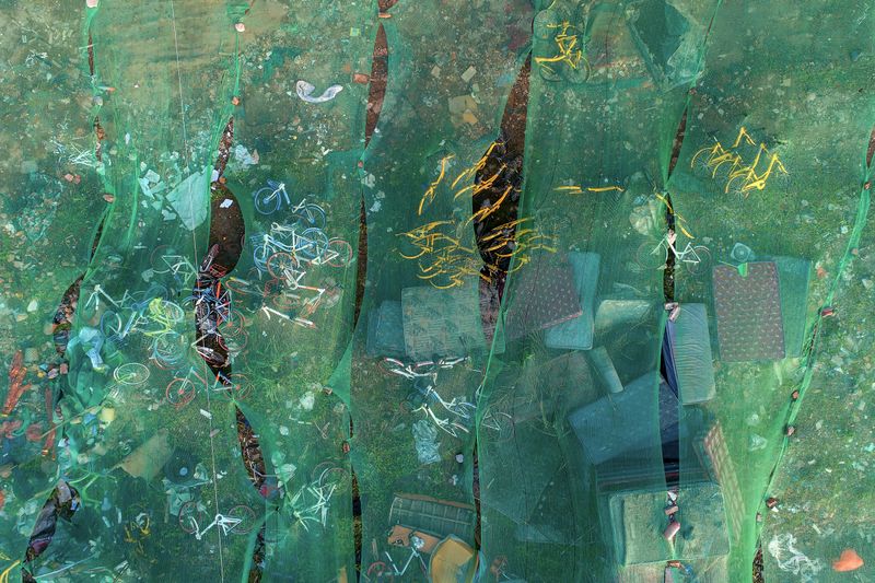 © WU GUOYONG - 14 Wuhan,China Scattered shared bicycles are dumped in garbage dumps. 2018/04/03