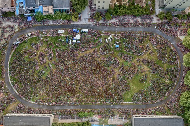 © WU GUOYONG - 06 Hefei, China An abandoned school with shared bicycles piled up in the playground. 2018/04/11