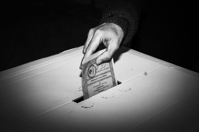 © Gianni Cipriano - An Italian voter casts a ballot in Naples.