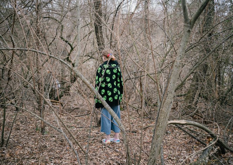 © Paola Chapdelaine - Silent’s niece, Autumn, among the trees surrounding their family house.