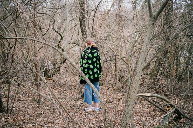 © Paola Chapdelaine - Silent’s niece, Autumn, among the trees surrounding their family house.