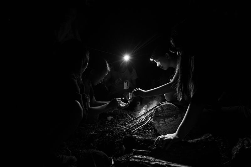 © Paola Chapdelaine - Girls from Troop 163 make a fire at the Alpine Scout camp.