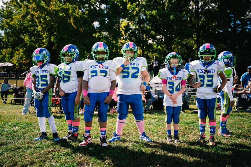 © Paola Chapdelaine - New Haven. October 5, 2024. Youth on the sidelines of a football tournament in New Haven.