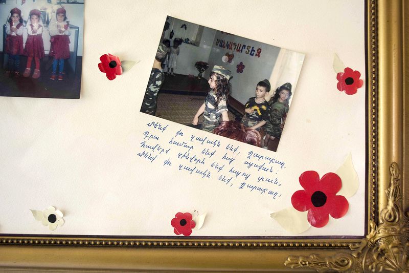 © Madelaine Ekserciyan - School act picture with frame in a school hall.