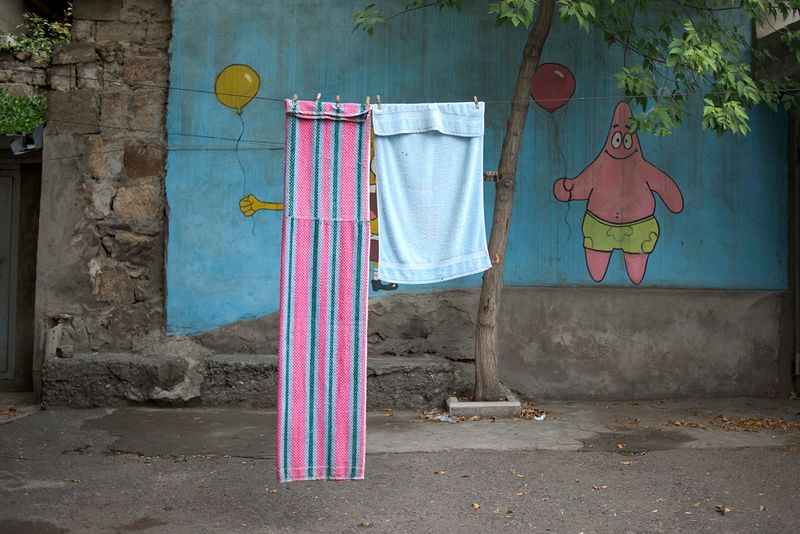 © Madelaine Ekserciyan - Spongebob and Patrick painted on an ally in a street in Erevan. Spongebob is covered buy a tole.
