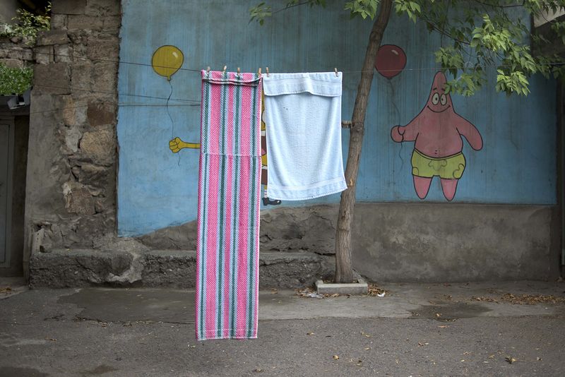 © Madelaine Ekserciyan - Spongebob and Patrick painted on an ally in a street in Erevan. Spongebob is covered buy a tole.