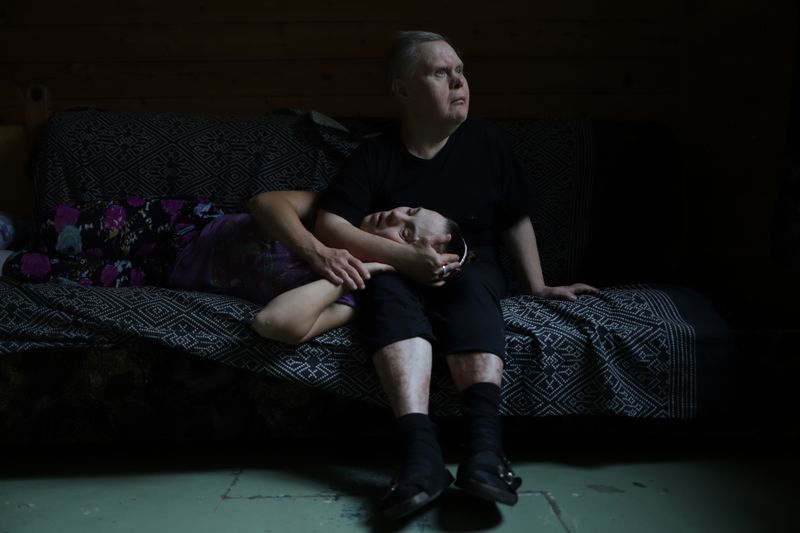 © Mary Gelman - Minya is sitting in his room with is a friend of Natasha are sitting in his room