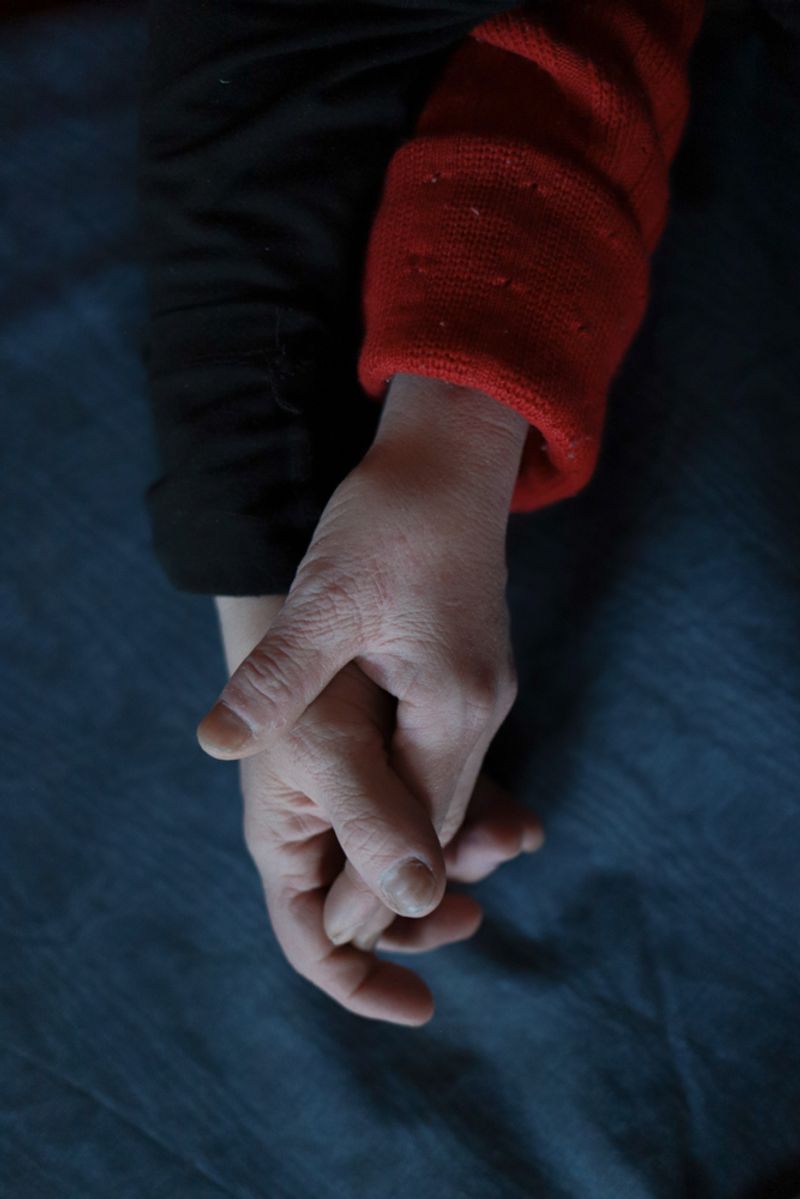 © Mary Gelman - This is the hands of Minya and Tatyana at the table