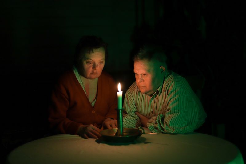 © Mary Gelman - Minya and Tatyana were sitting at the table after the bible evening in the village.