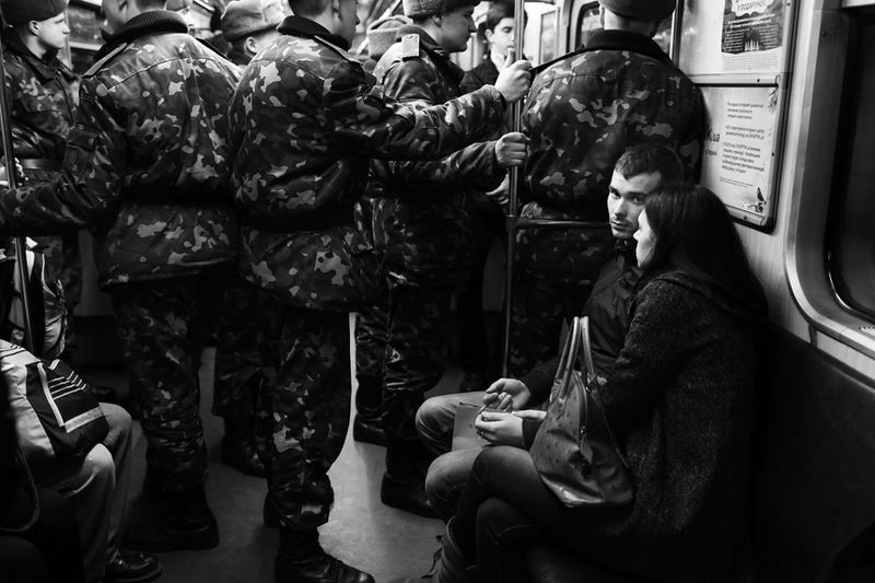 © Dina Oganova - Couple and solders in the metro of Kiev are going to the EuroMaidan.