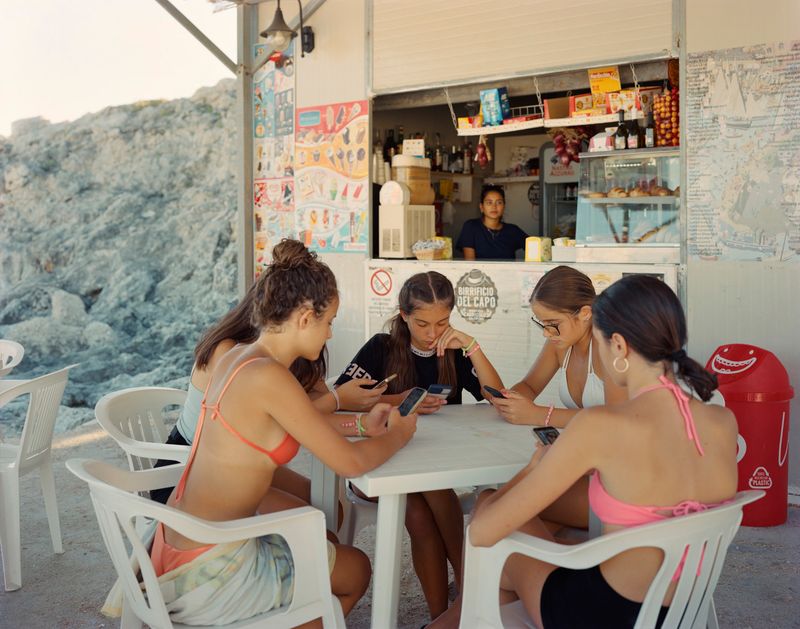 © Murray Ballard - Girls on their phones, Porto Tricase, Salento, August 2022