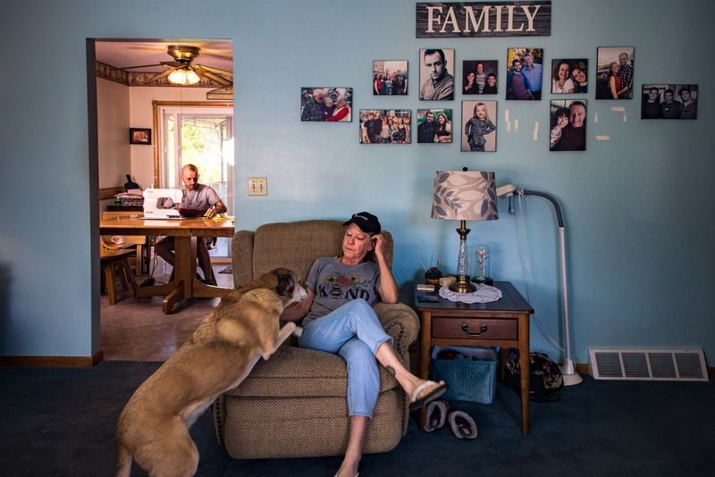 © Michael Snyder - French Silk stitches a dress at her mother's house.