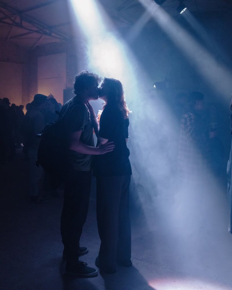 © Zifan Zhang - Young couple kiss in a concert in Riga, Latvia on March 29, 2025.