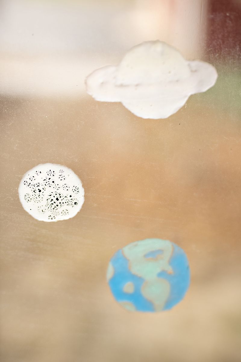 © Danielle Ezzo - Hand-Painted Planets on My Bedroom Window, 2024