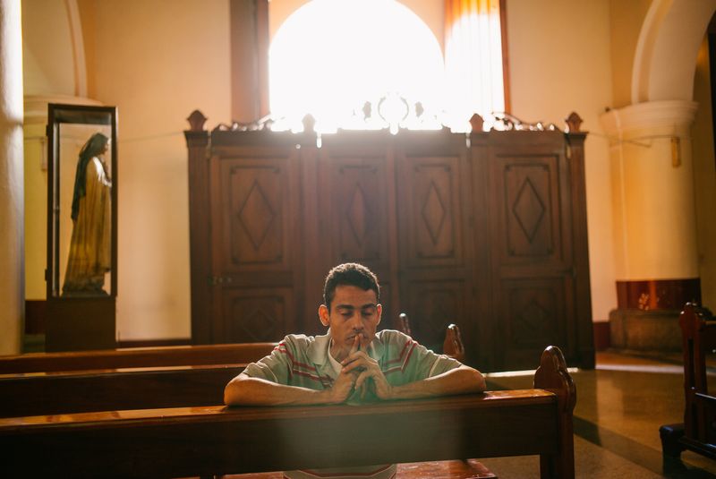 © José Sarmento  Matos - Josué Artiaga (36) is praying at a Church in Chacao, Caracas, Venezuela. 11th January 2018.