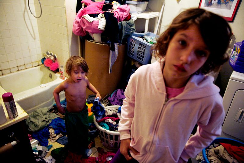 © Uno  Yi - David tries to find a shirt he will be wearing for the day while Regina helps him out.