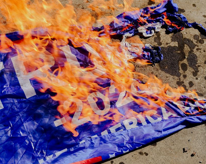 © Jordan Conway - A Trump 2024 flag set on fire at "anarchist beach" in Oregon.
