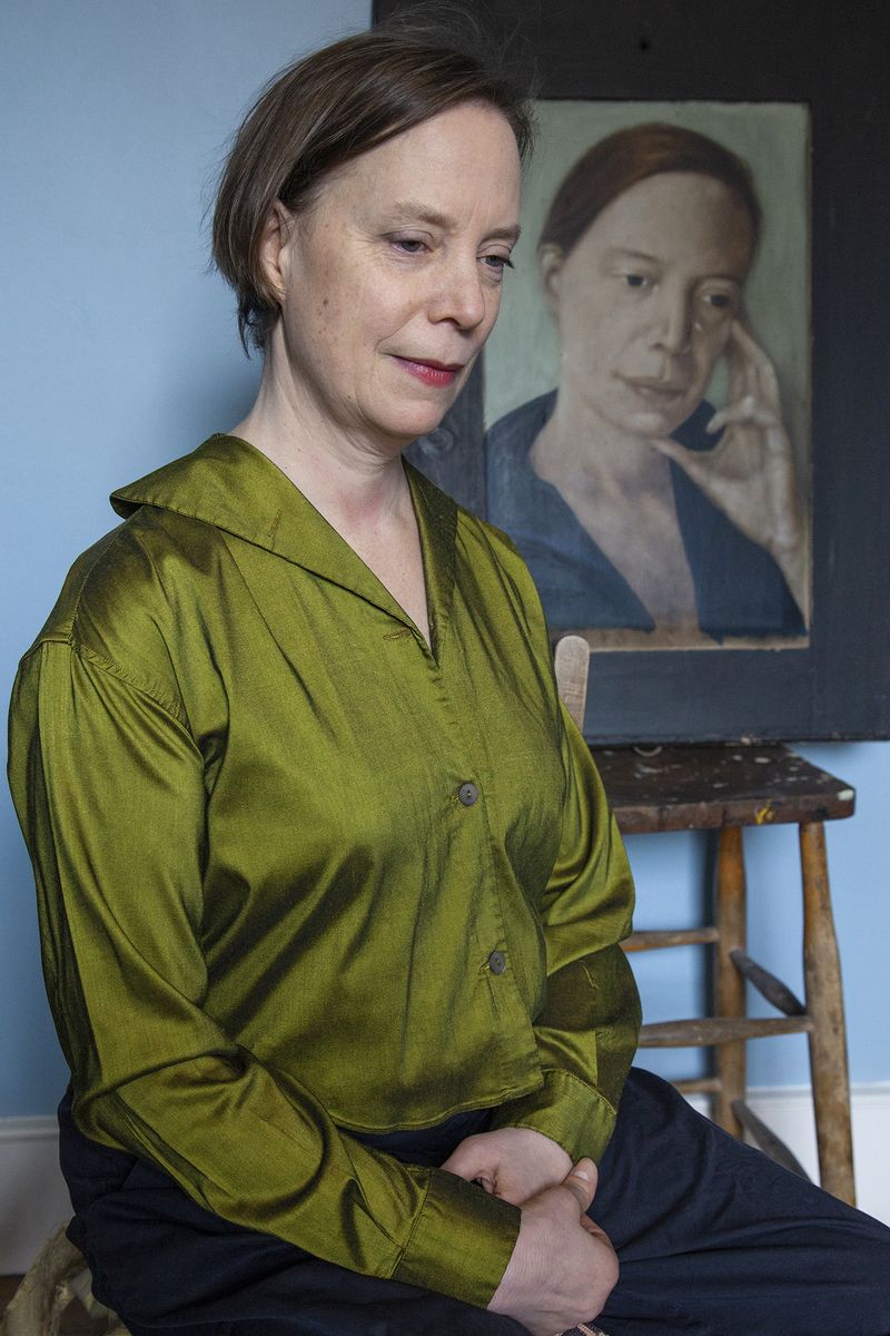 © Heather McDonough - Josie, who appears elsewhere in this series, sits in front of her own portrait, painted twenty years ago by her husband.