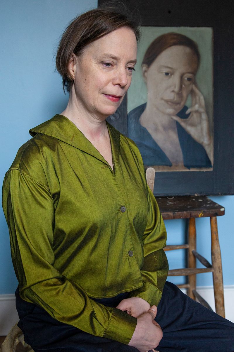 © Heather McDonough - Josie, who appears elsewhere in this series, sits in front of her own portrait, painted twenty years ago by her husband.