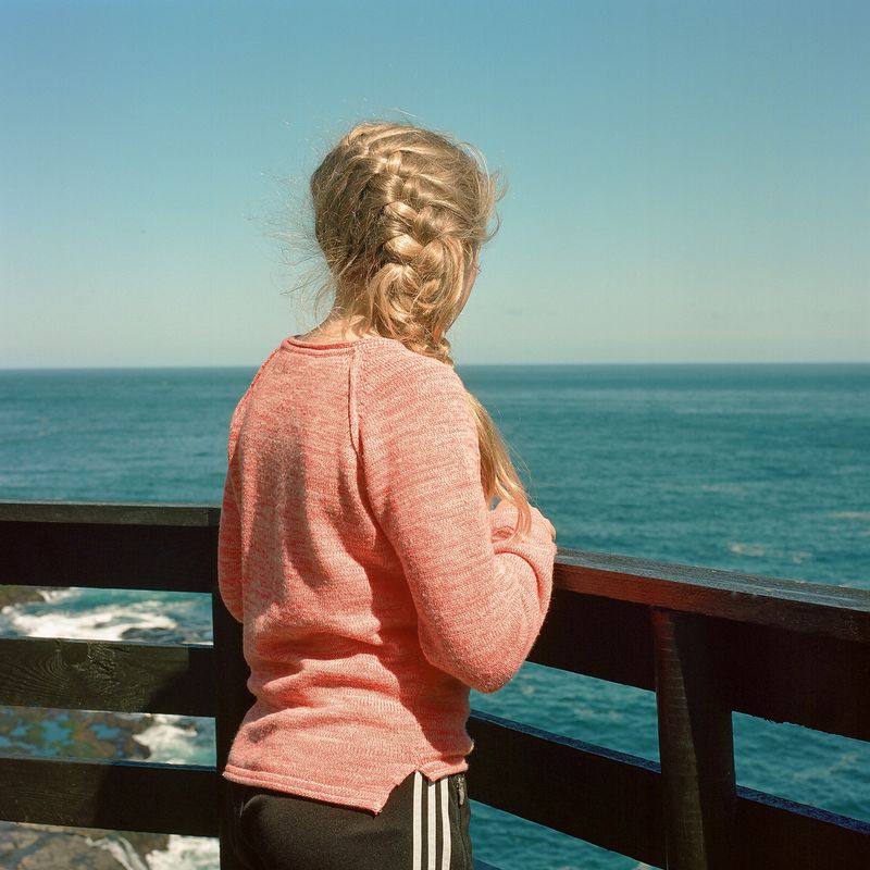 © Silvia Varela - A girl stares at the horizon at the village of Mikladur, on the Faroese island of Kalsoy.