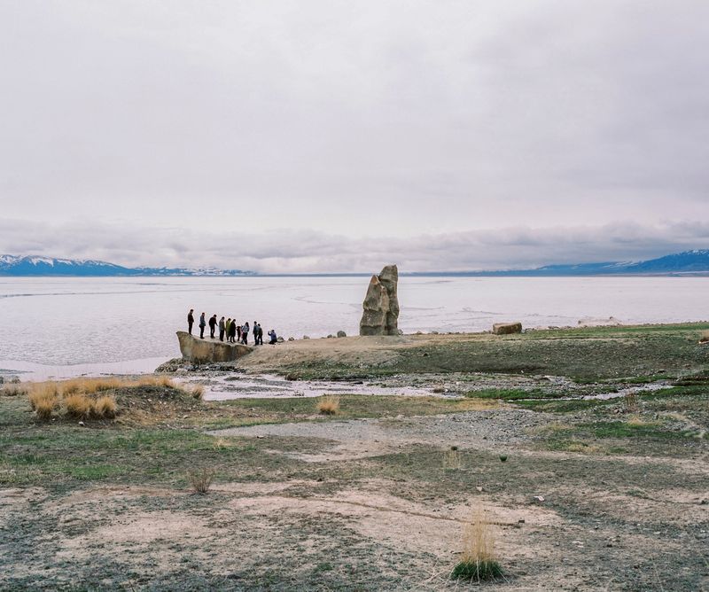 © Patrick Wack - May 2017. Xinjiang province, China. View of Sayram lake in northern Xinjiang. Han Chinese tourists posing for a group photo.