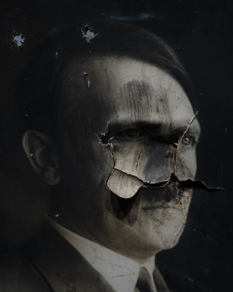 © Stefan Nieland - Destroyed portrait of Adolf Hitler exhibited at the Museum„Le Memorial“ in Caen. Caen, France, 29 December 2023.