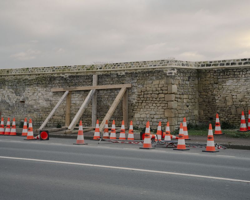 © Stefan Nieland - Renovation of an old wall near the former prison camp of Fleury.Fleury-sur-Orne, France, 29 December 2023