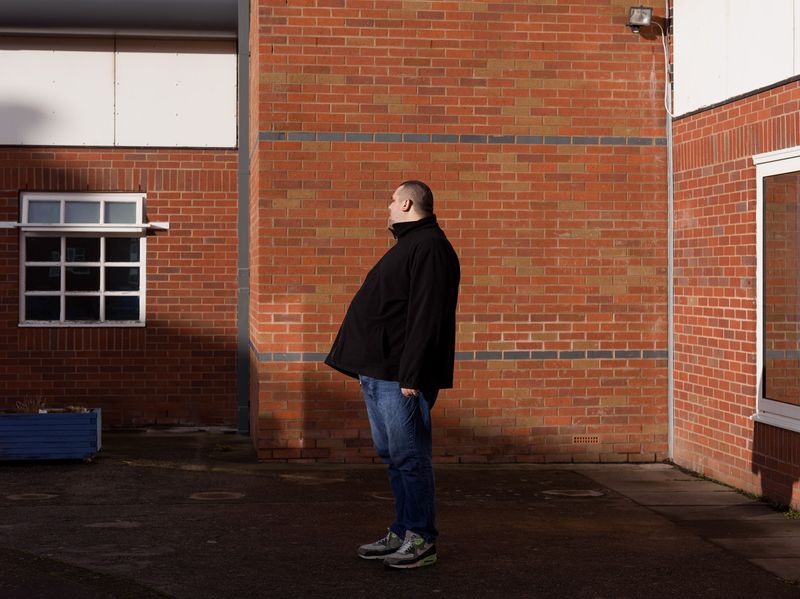 © Polly Braden - John in the courtyard of Weaver Clinic.