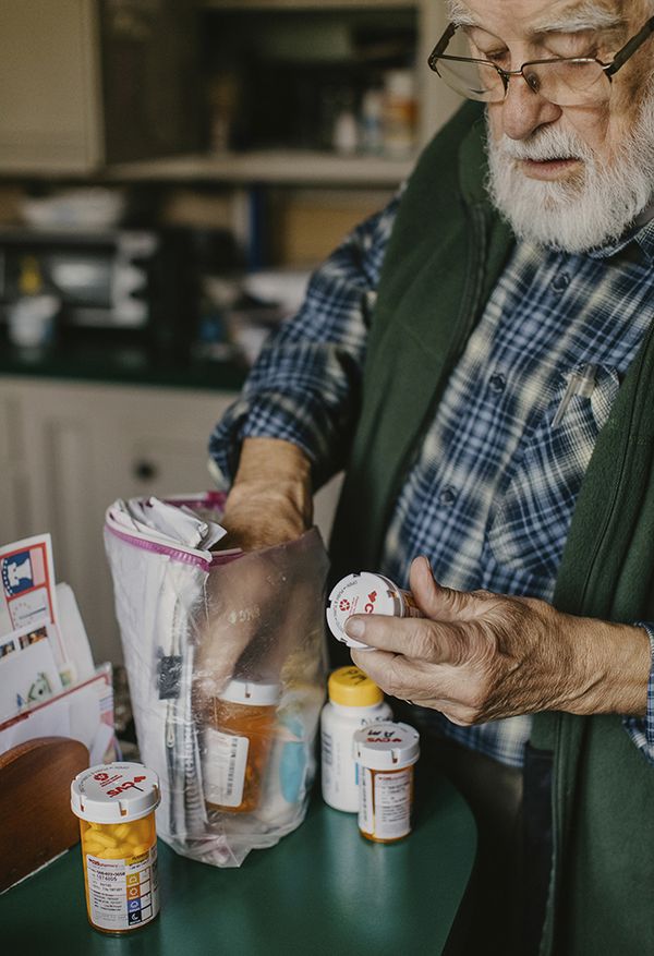 © Hannah Latham - Gramp Organizing Medications, October 2020, 13x19”, Archival Inkjet Print.